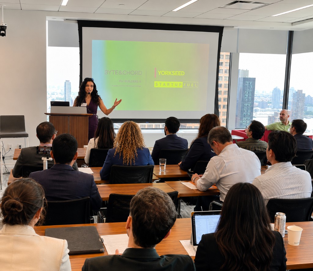 Alisha Outridge presenting to a room of professionals at a Byte&Chord session